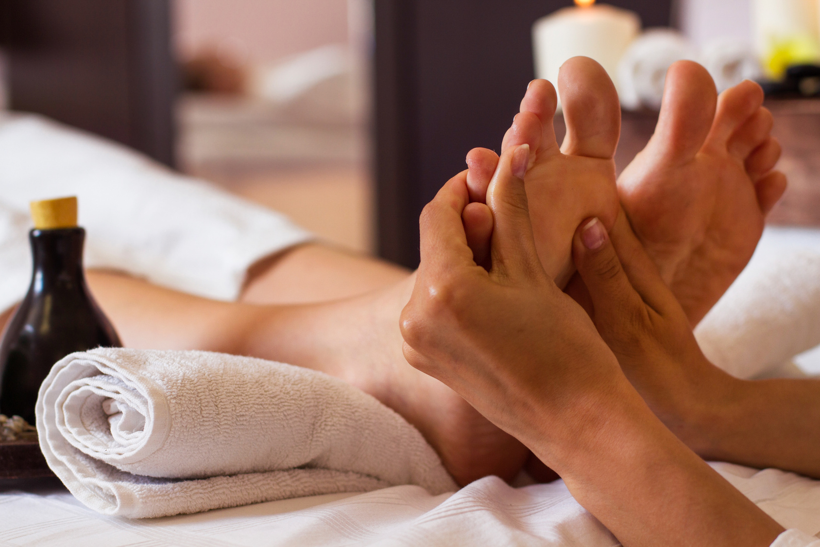 Massage of human foot in spa salon – Soft focus
